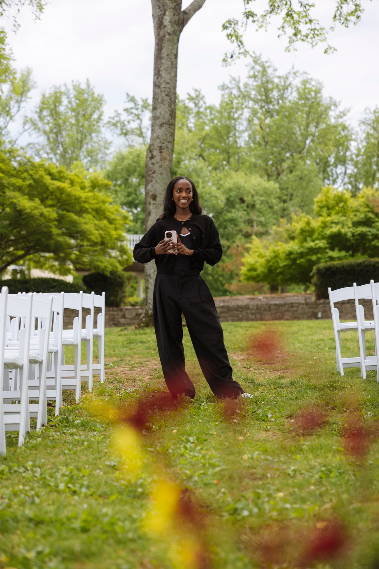Judea standing centered in the ceremony aisle