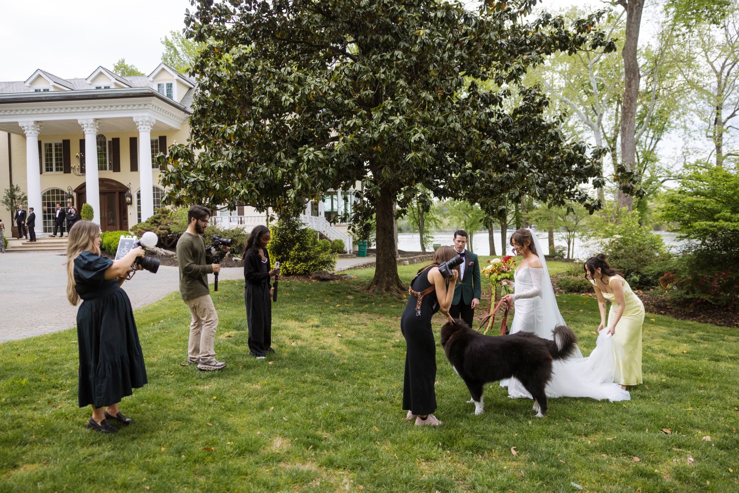 Full crew spread across the lawn at a Nashville mansion wedding